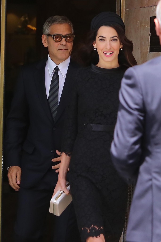 George Clooney and his wife Amal Alamuddin come out from their hotel in Rome, Italy.
